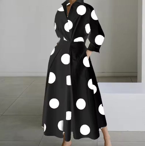 Black shirt dress with large white polka dots, long sleeves, collar, belted waist
