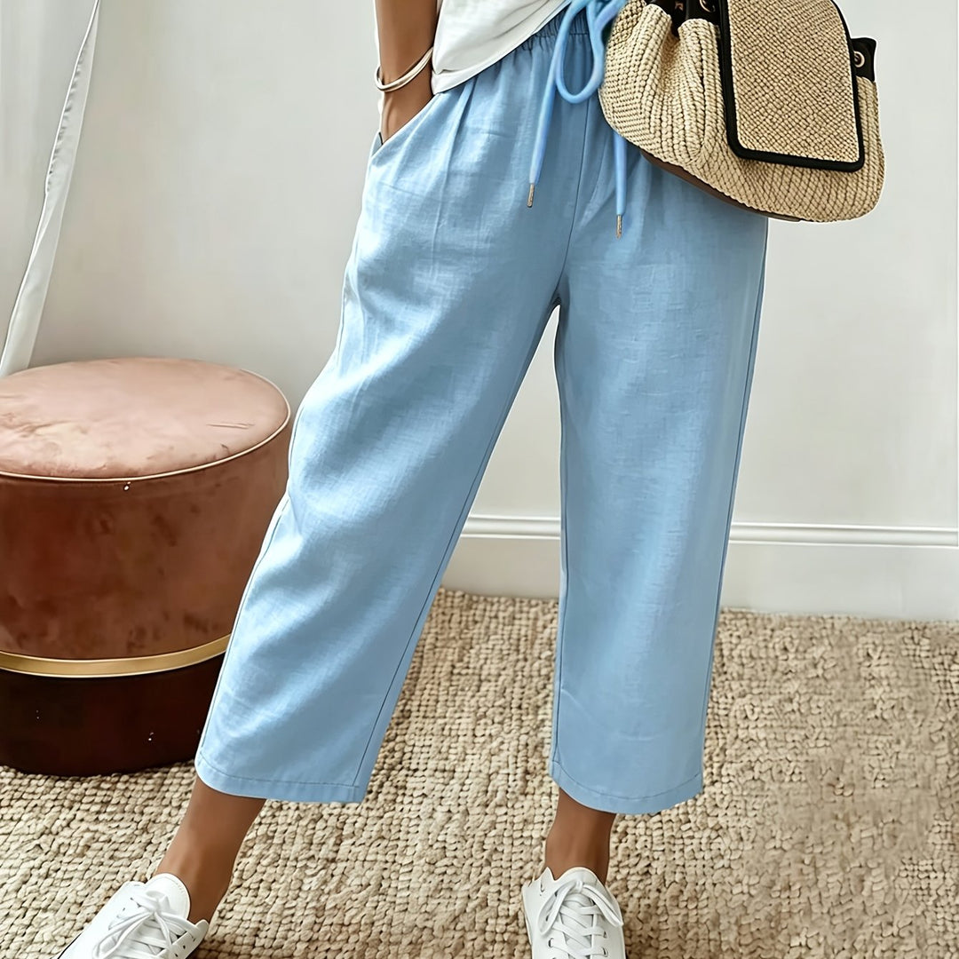 Light blue cropped wide-leg trousers with drawstring waist and ankle-length hem