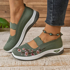 Green knit orthopedic comfort slip-on shoes, side view, with floral embroidery