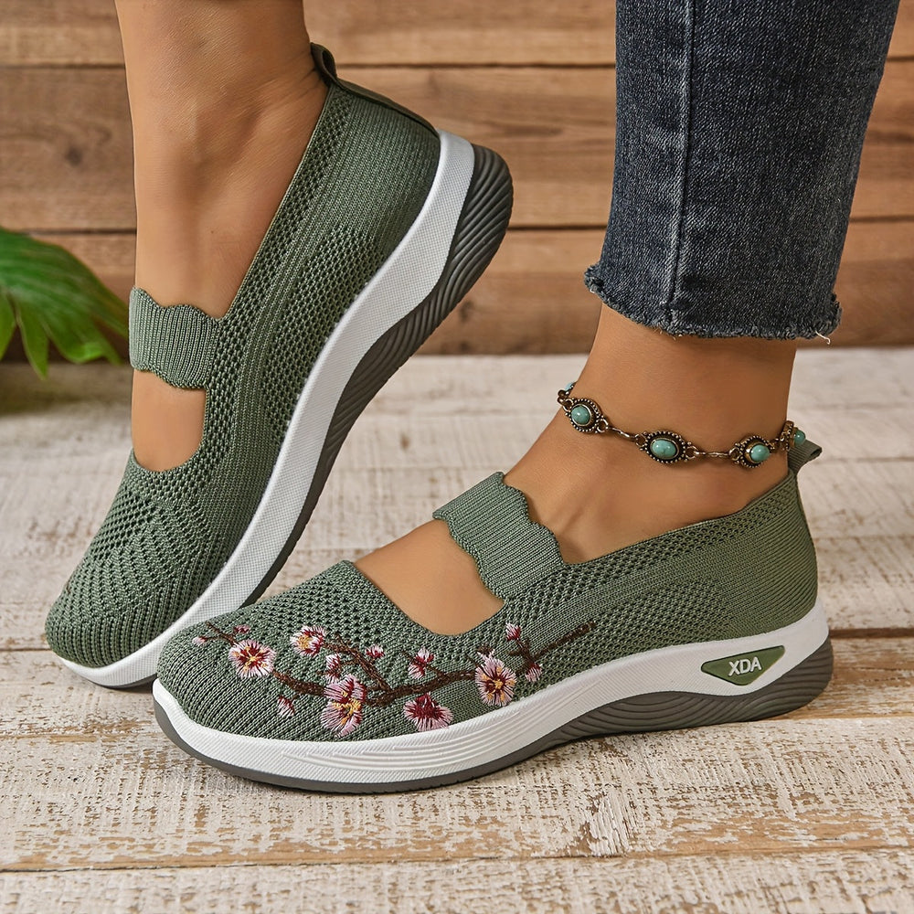 Green knit orthopedic comfort slip-on shoes, side view, with floral embroidery