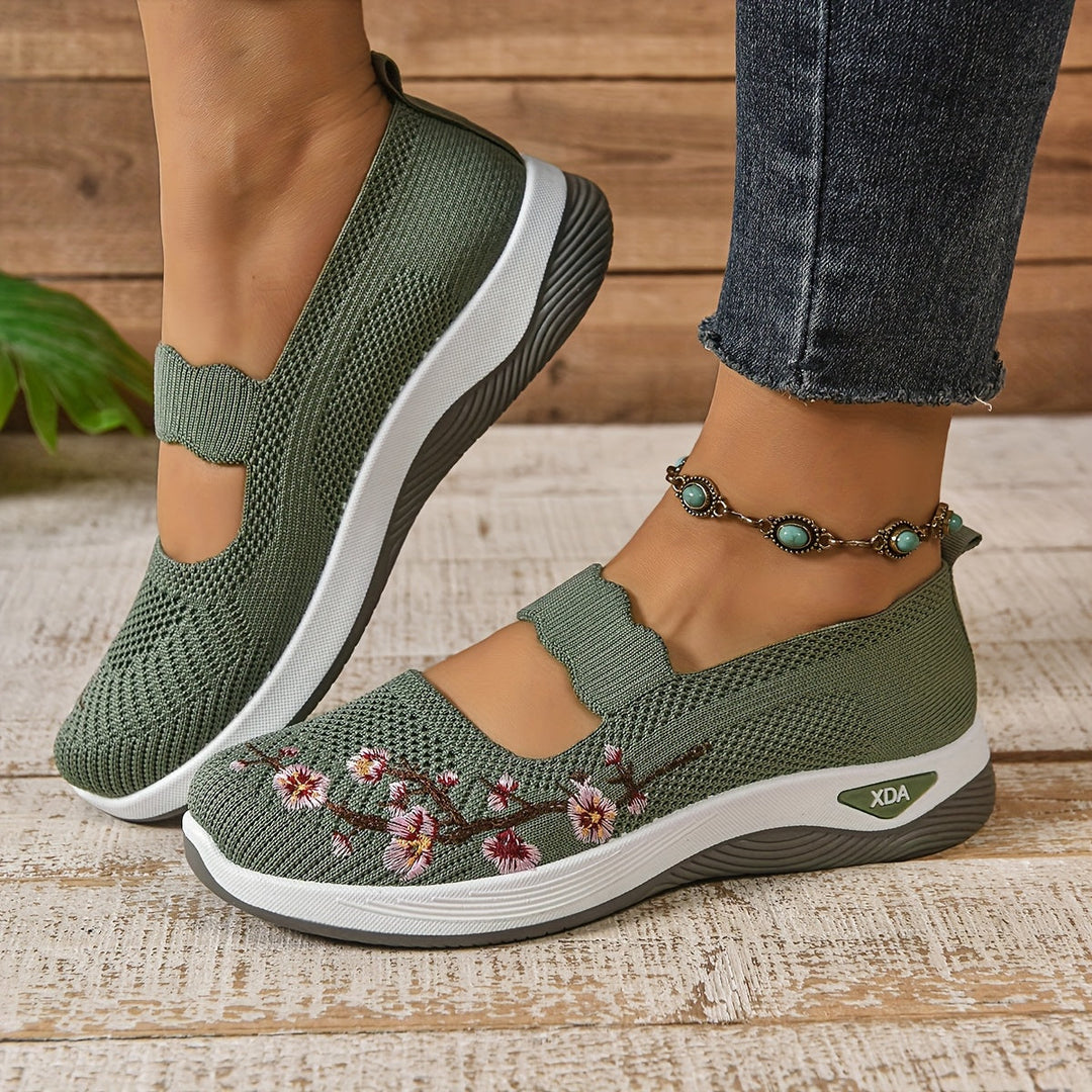 Green knit orthopedic comfort slip-on shoes, side view, with floral embroidery
