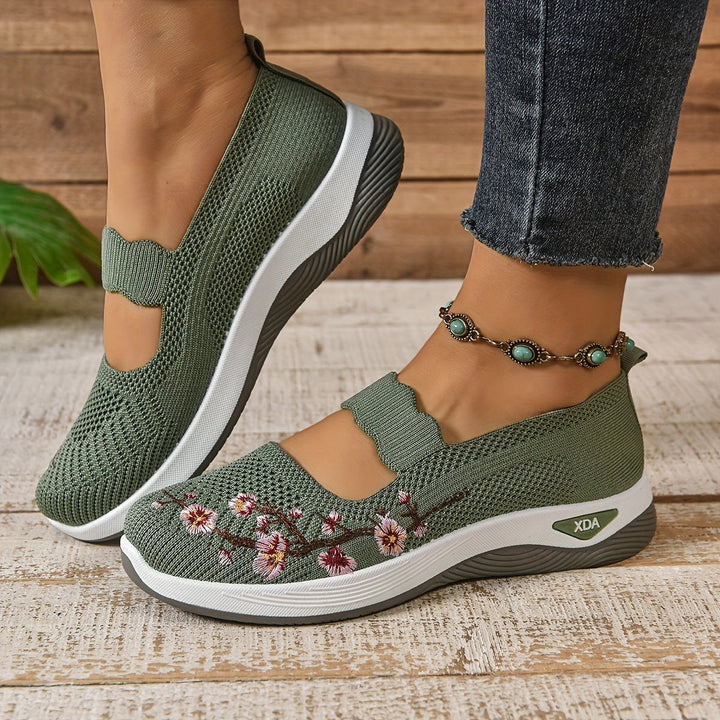 Green knit orthopedic comfort slip-on shoes, side view, with floral embroidery