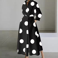 Black shirt dress with large white polka dots, long sleeves, button front