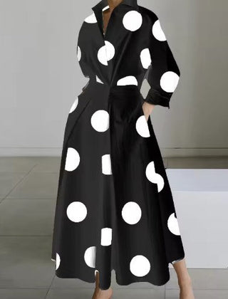 Black shirt dress with large white polka dots, long sleeves, button front