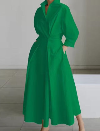 Green shirt dress with buttoned V-neck, long sleeves, cinched waist