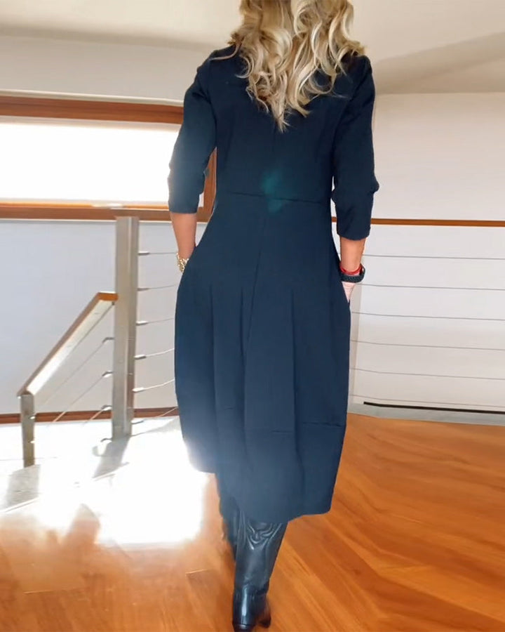 Nia casual elegance dress, dark color, midi length, three-quarter sleeves, back view