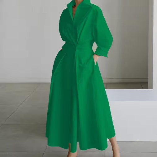 Green shirt dress with long sleeves, collar, and tie waist, solid A-line midi