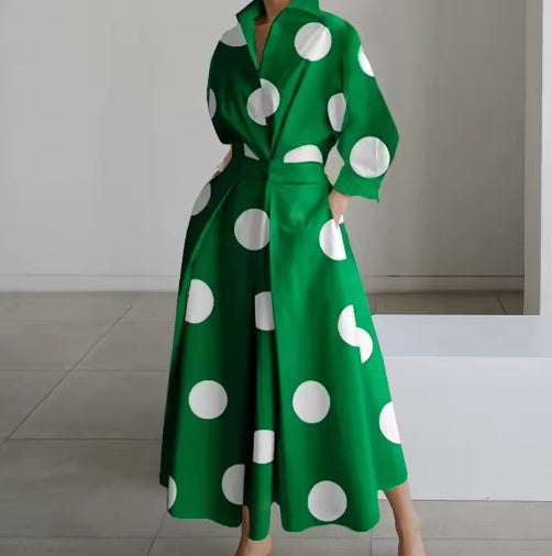 Green shirt dress with large white polka dots, long sleeves, collar, belted waist