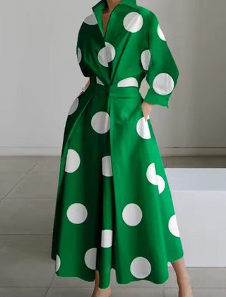 Green shirt dress with large white polka dots, long sleeves, belted waist