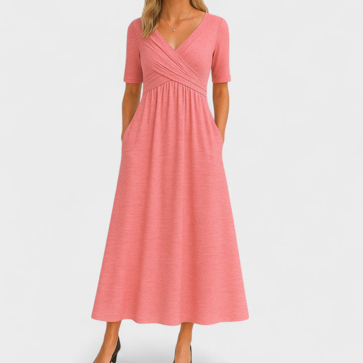 Pink wrap-style midi dress with V-neck, short sleeves, and gathered midsection