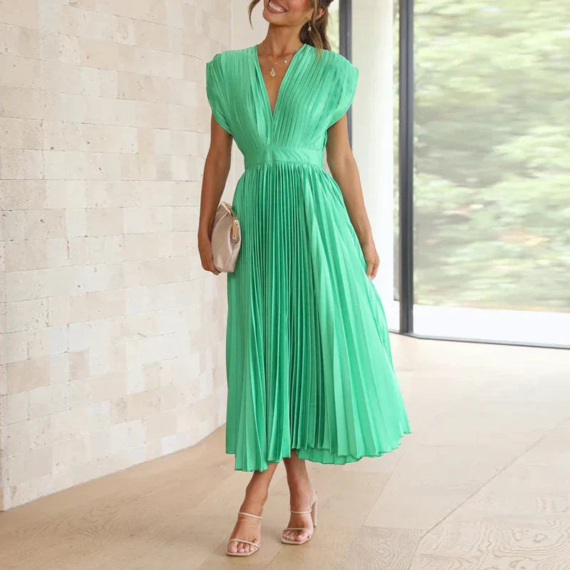 Green pleated V-neck maxi dress with cap sleeves and gathered waist