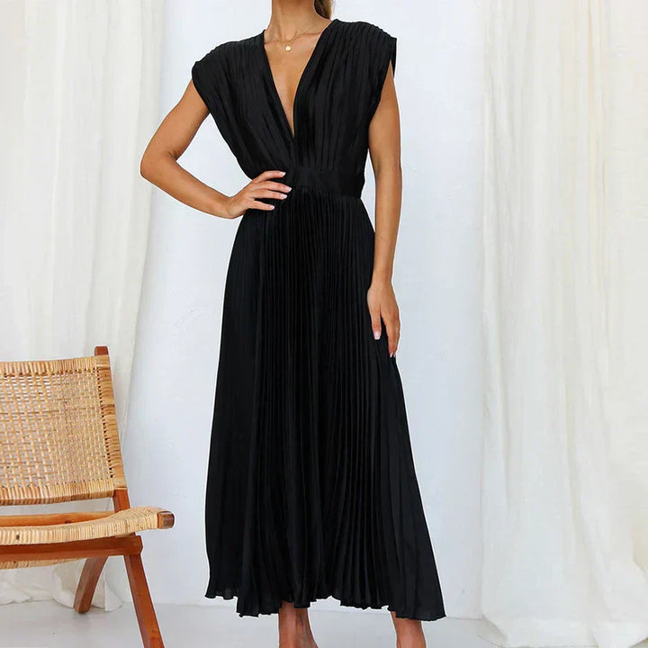 Black pleated V-neck maxi dress with cap sleeves and gathered waist