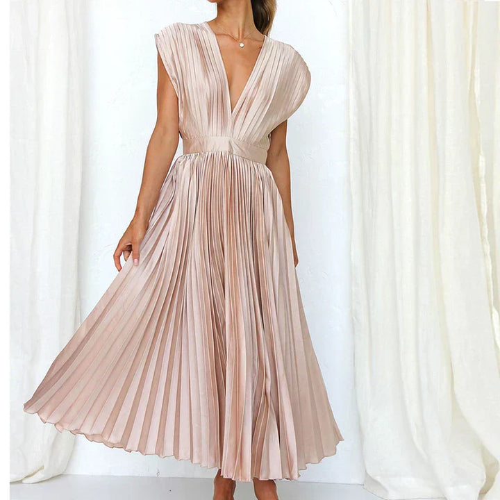 Blush pink pleated V-neck maxi dress with cap sleeves and gathered waist