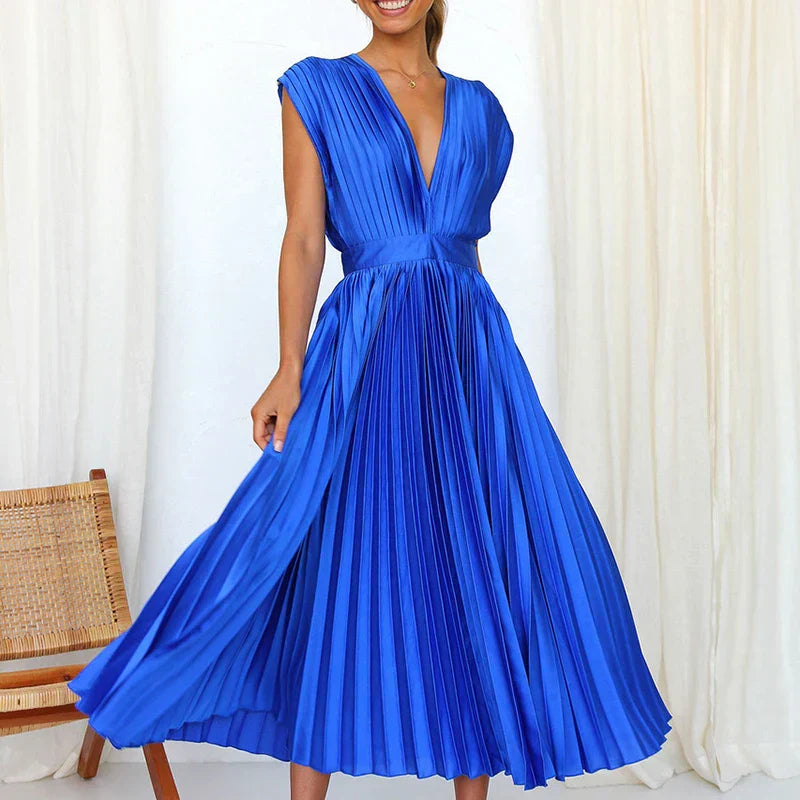 Royal blue pleated V-neck maxi dress with cap sleeves and gathered waist