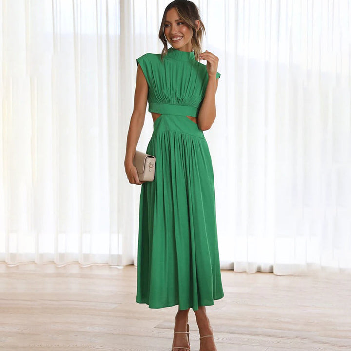 Green sleeveless maxi dress with high neck and gathered waist pleated skirt