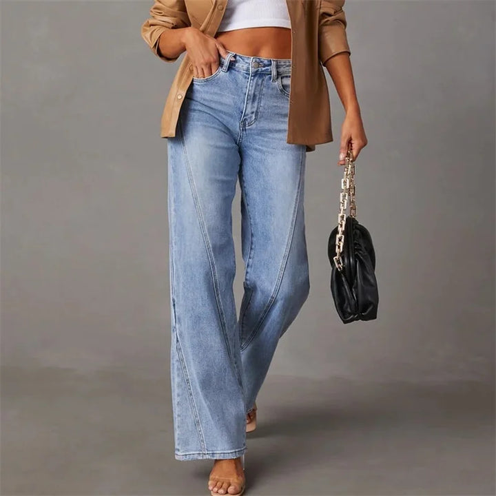 Faded light blue flared jeans with button fly, belt loops, and five-pocket styling