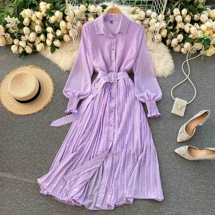Purple polka dot chiffon pleated dress with button front, long sleeves, tied waist.