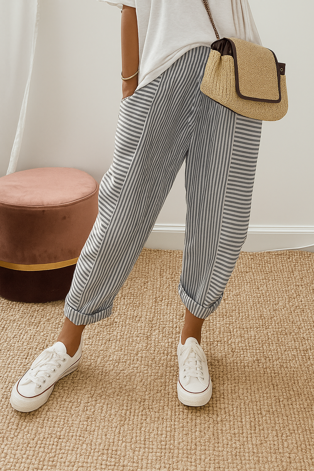 Dark-and-white striped jogger pants with cuffed ankle and relaxed straight legs