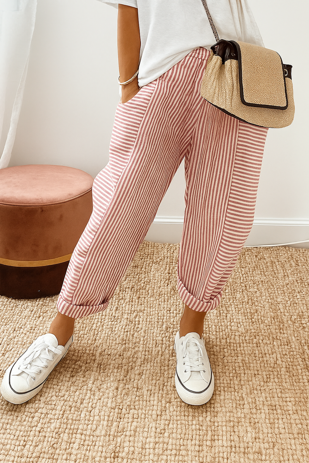 Red-and-white striped jogger pants with cuffed ankle and elastic drawstring waist