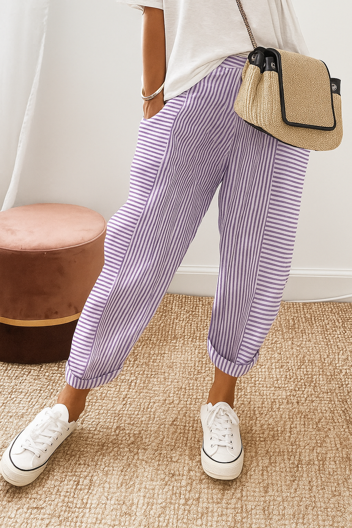 Purple-and-white striped jogger pants with cuffed ankle and elastic drawstring