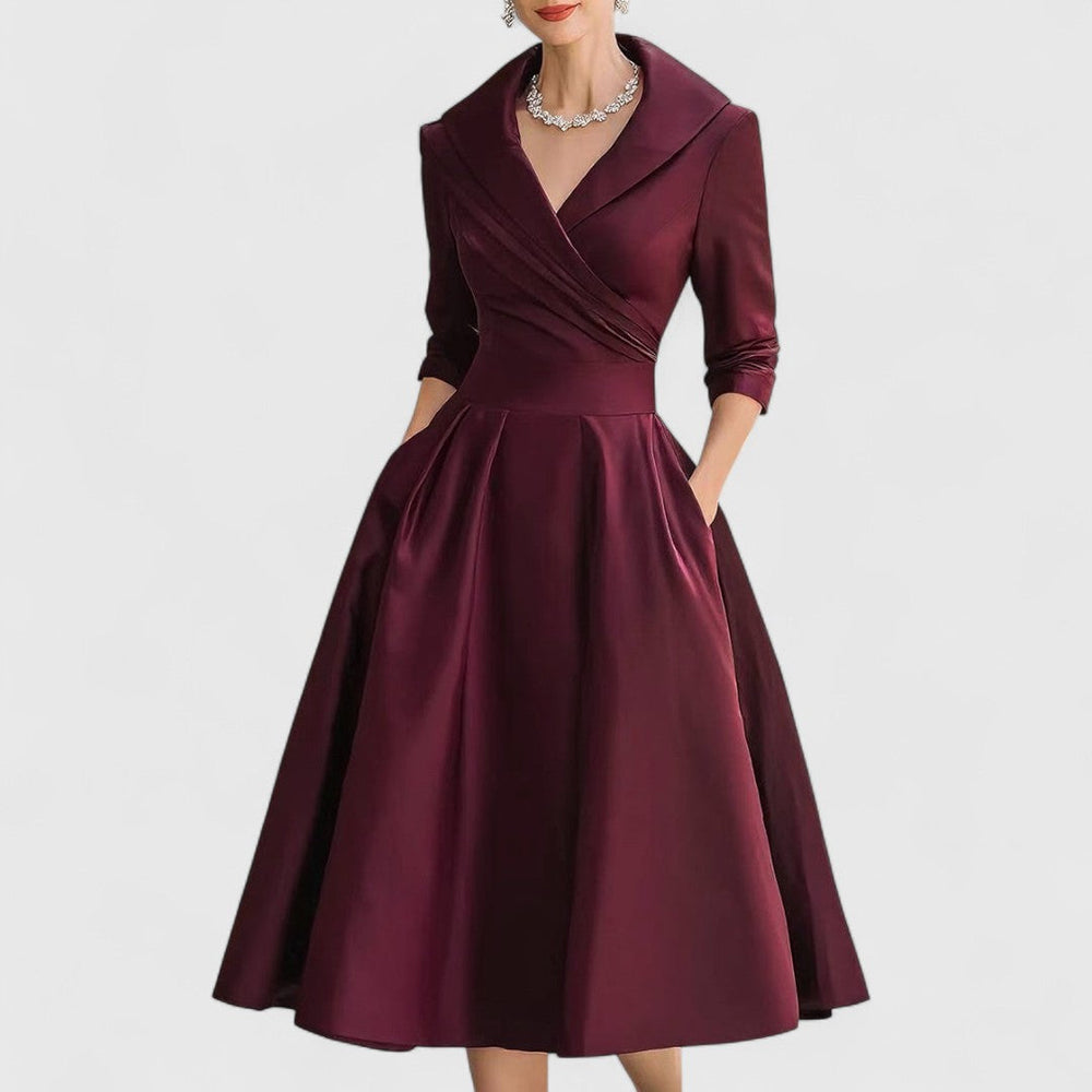 Deep red midi wrap dress with V-neck, 3/4 sleeves, pleated full skirt.