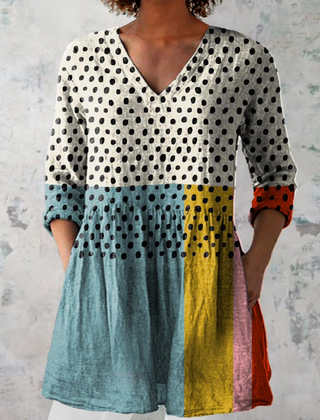 Long V-neck blouse with multicolor block panels and black polka-dot print