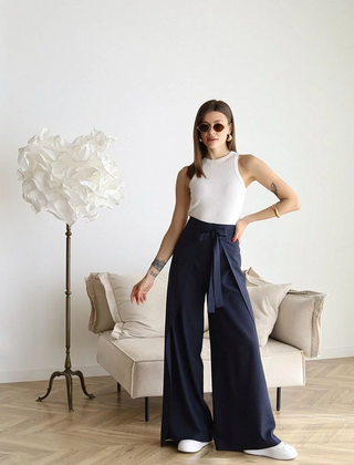 Navy wide-leg trousers with front waist tie and flowing wide legs