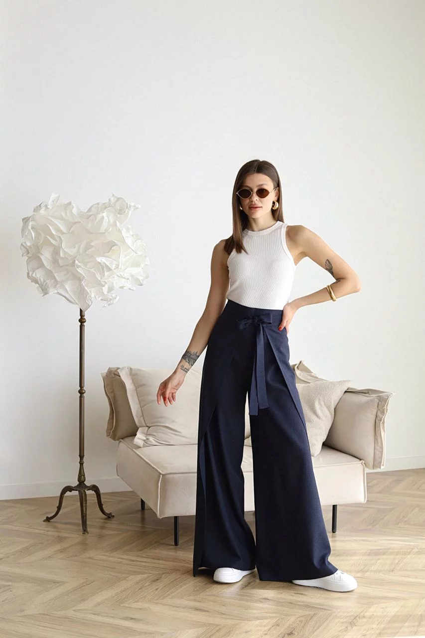 Navy wide-leg trousers with front waist tie and flowing wide legs
