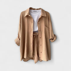 Beige two-piece set, button-front shirt over drawstring-waist shorts