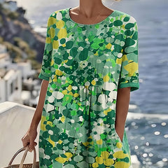 Green floral midi dress with short sleeves and round neckline, loose gathered waist