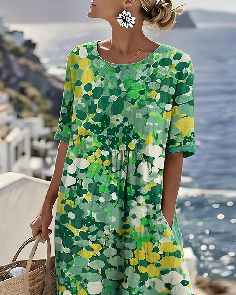 Green floral midi dress with short sleeves and round neckline, loose gathered waist