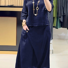 Navy two-piece outfit: long-sleeve tunic and gathered midi skirt with pockets