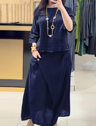 Navy two-piece outfit: long-sleeve tunic and gathered midi skirt with pockets