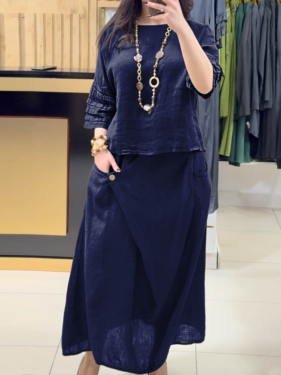 Navy two-piece outfit: long-sleeve tunic and gathered midi skirt with pockets