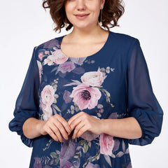 Navy floral midi dress close-up with round neckline and sheer 3/4 sleeves