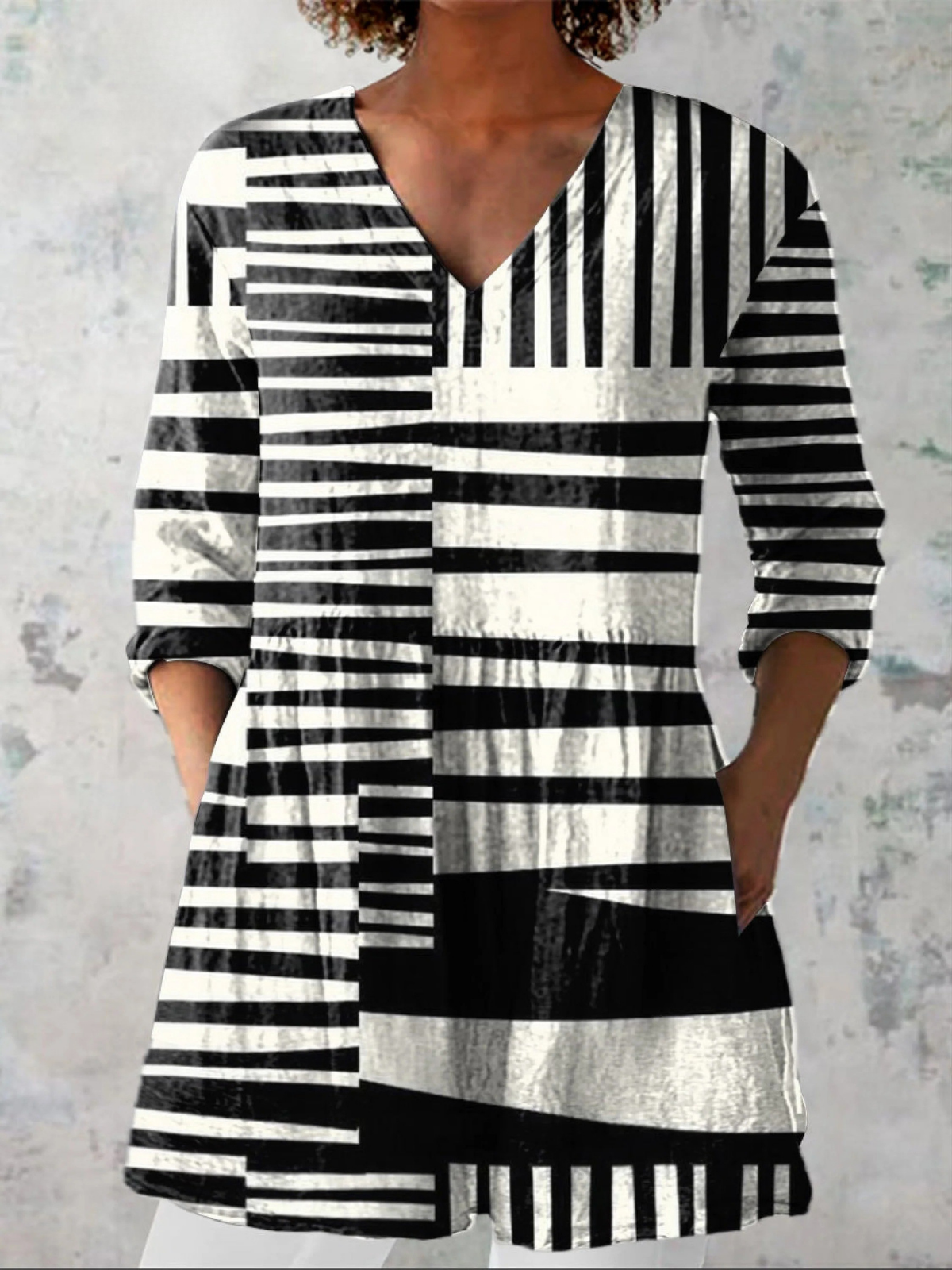 Black and white striped long-sleeve blouse with V-neck