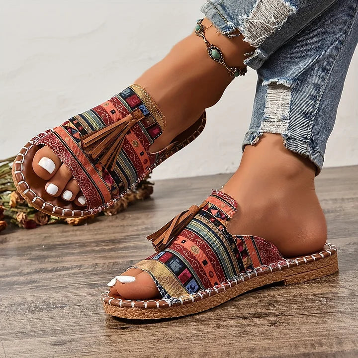 Casual orthopedic sandals with red multicolor textile upper and side tassel detail