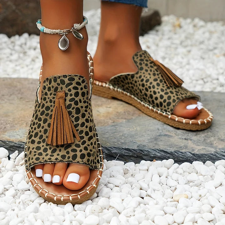 Casual orthopedic sandals with leopard-print upper and brown tassel on braided strap