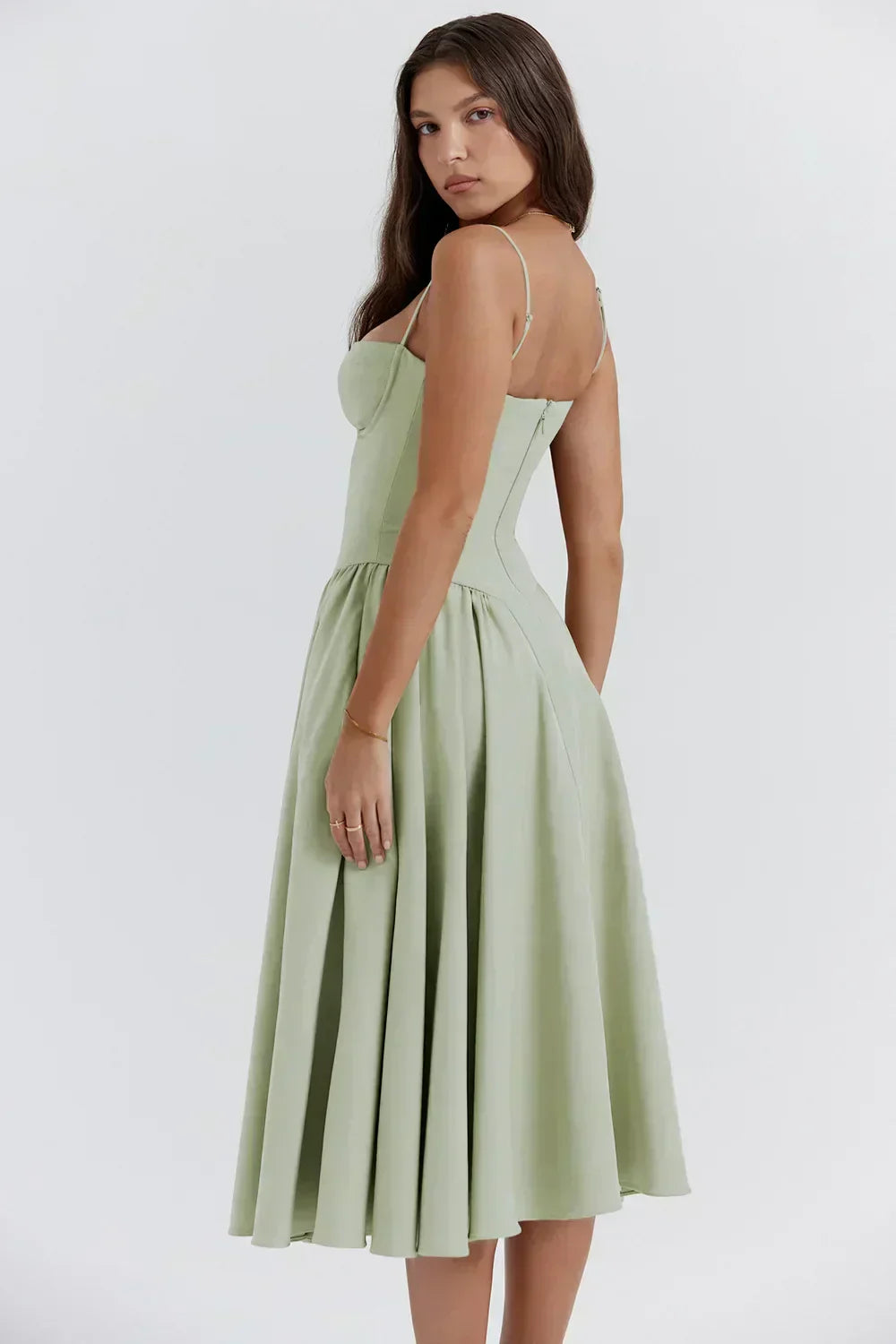 Light green corset sundress with sweetheart neckline and pleated midi skirt