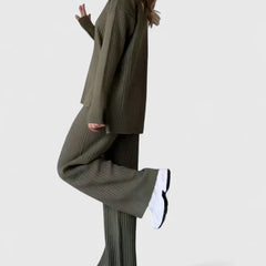 Ribbed knit two-piece set in olive green, side view of turtleneck top and flared pants