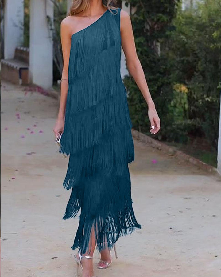 Teal one-shoulder fringe dress with layered tassel tiers and fitted silhouette