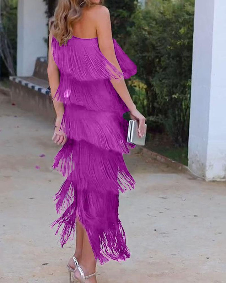 Off-shoulder tiered fringe maxi dress in raspberry red, side view with tassel layers
