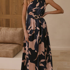 Navy maxi dress with pink floral print, belted waist detail, halter-style neckline.