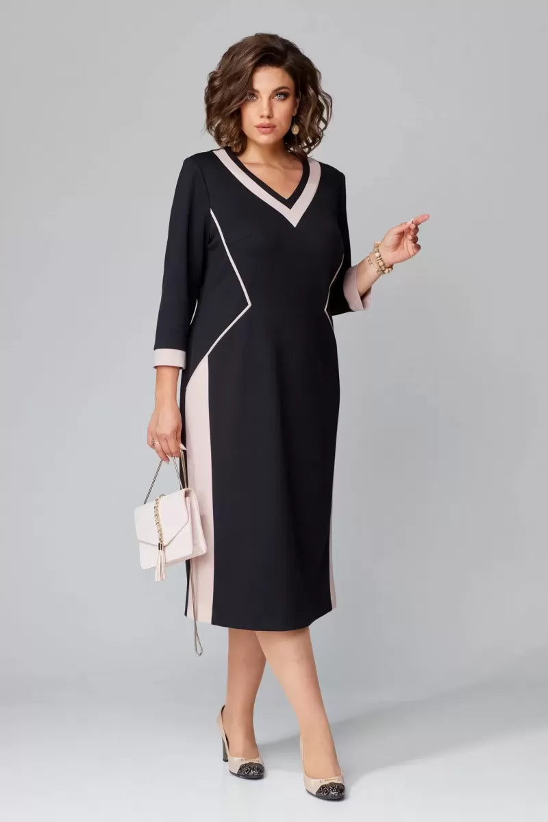 Black V-neck dress with contrast white trim, 3/4 sleeves, knee-length shift silhouette