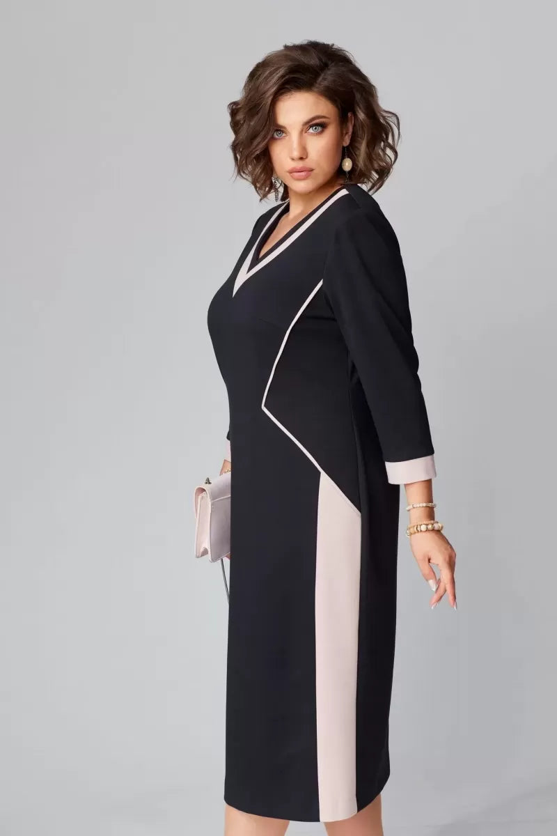 Black V-neck sheath dress with white contrast panels and 3/4 sleeves, midi length