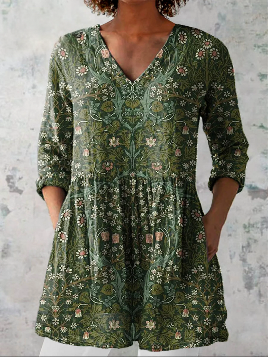 Green long-sleeve V-neck blouse with floral print and tiered waist