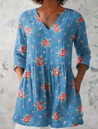 Long V-neck blouse in blue with multicolor floral print, three-quarter sleeves