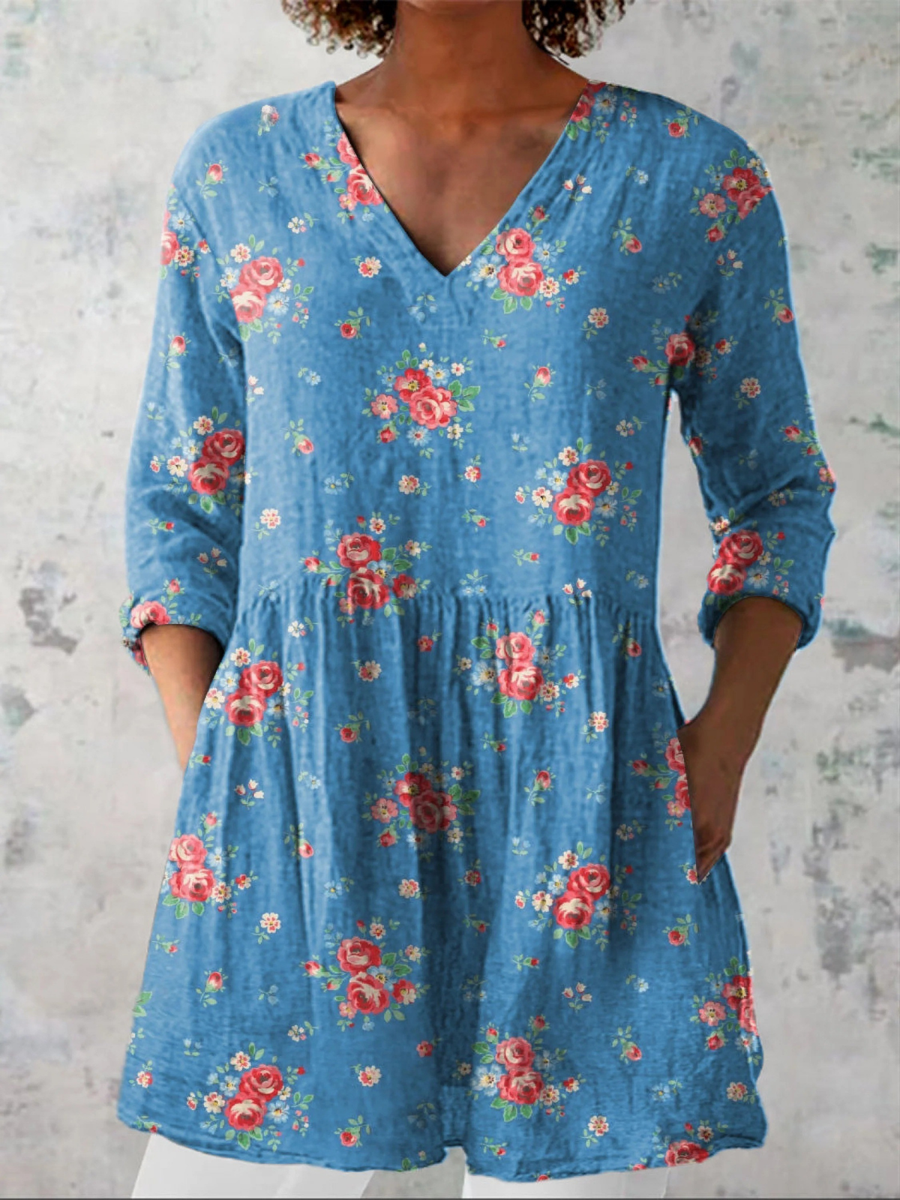 Long V-neck blouse in blue with multicolor floral print, three-quarter sleeves