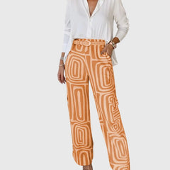 Emilia™ pants set: white blouse, orange geometric trousers, studded belt