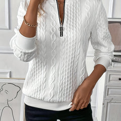 White zip-up cable knit sweater with long sleeves, textured knit and metal zipper pull